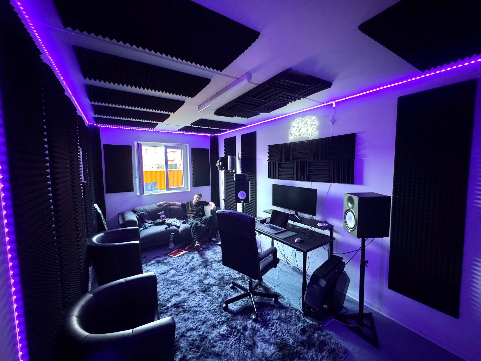 Sick Slack studio lounge with sofa and acoustic panels
